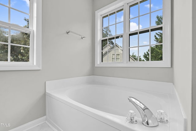 8820 Waynick Dr, Raleigh, NC 27617 - full bath with healthy amount of natural light, a garden tub, and baseboards