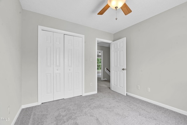 8820 Waynick Dr, Raleigh, NC 27617 - unfurnished bedroom with carpet floors, a closet, baseboards, and a ceiling fan