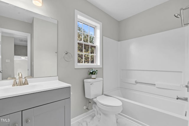 8820 Waynick Dr, Raleigh, NC 27617 - bathroom featuring toilet, marble finish floors, vanity, baseboards, and shower / bathtub combination