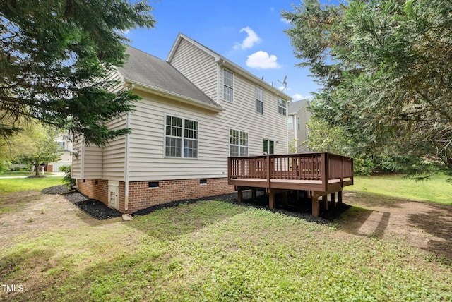 8820 Waynick Dr, Raleigh, NC 27617 - rear view of house featuring crawl space, a yard, and a wooden deck