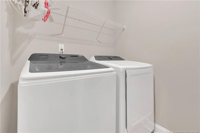 washroom with washer and clothes dryer