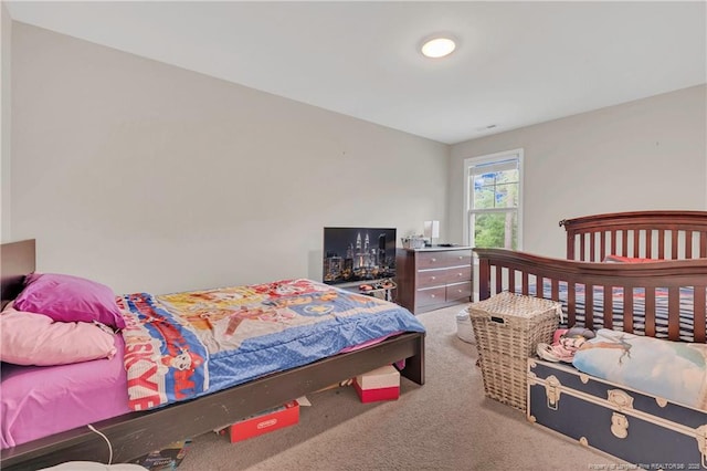 bedroom featuring carpet