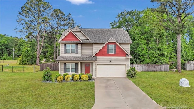 view of front of house with an attached garage, driveway, and a shingled roof
