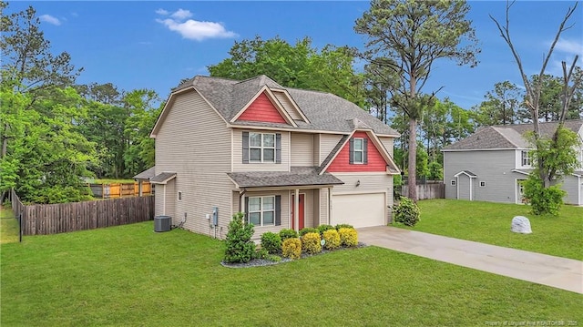 view of front of property with driveway, an attached garage, and central AC