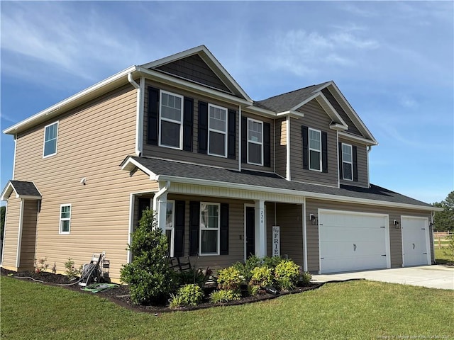 view of front of home with driveway, a front yard, a porch, and an attached garage