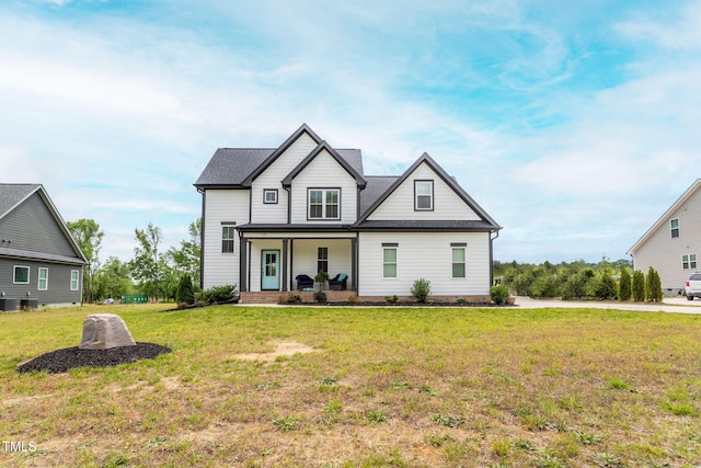 474 Pine Ridge Rd, Zebulon, NC 27597 - view of front of home featuring a porch and a front yard