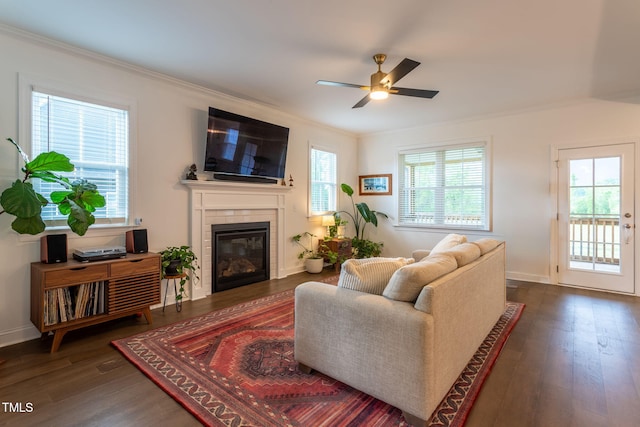 474 Pine Ridge Rd, Zebulon, NC 27597 - living room featuring crown molding, ceiling fan, a fireplace, wood finished floors, and baseboards