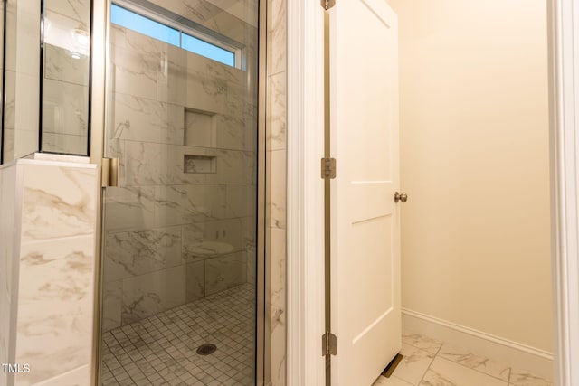474 Pine Ridge Rd, Zebulon, NC 27597 - full bathroom featuring marble finish flooring, a shower stall, and baseboards