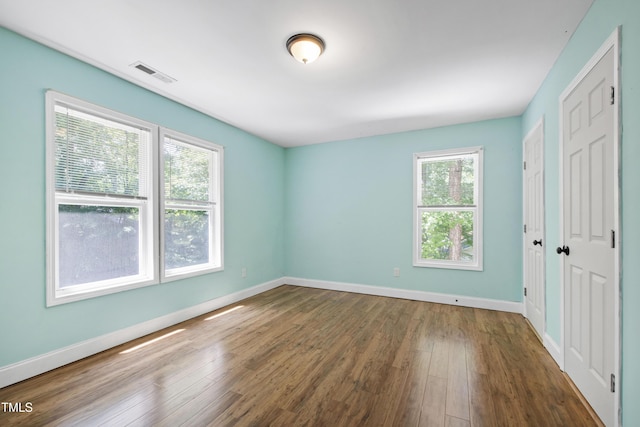 1005 Temple St, Raleigh, NC 27609 - unfurnished bedroom featuring wood finished floors and baseboards