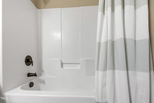 1005 Temple St, Raleigh, NC 27609 - bathroom featuring shower / tub combo with curtain
