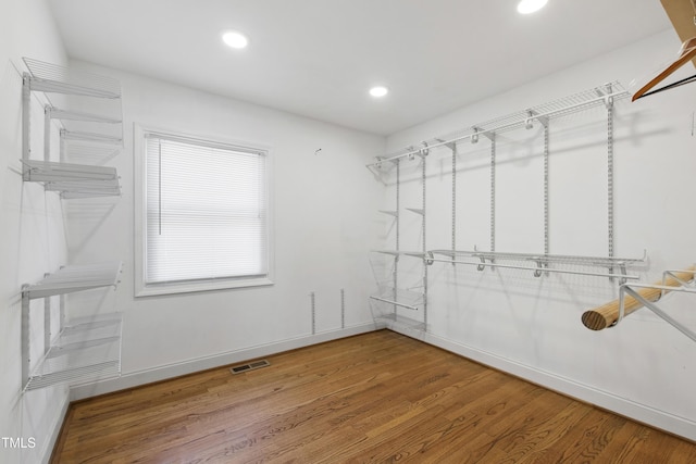 1005 Temple St, Raleigh, NC 27609 - walk in closet with wood finished floors