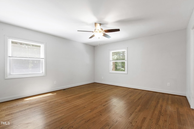 1005 Temple St, Raleigh, NC 27609 - unfurnished room with ceiling fan, wood finished floors, and baseboards