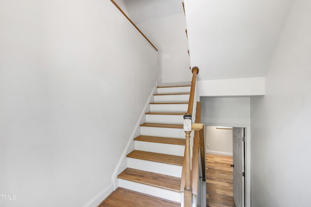 1005 Temple St, Raleigh, NC 27609 - staircase with wood finished floors and baseboards