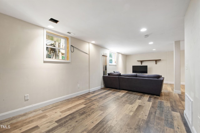 1005 Temple St, Raleigh, NC 27609 - living room featuring wood finished floors, recessed lighting, and baseboards