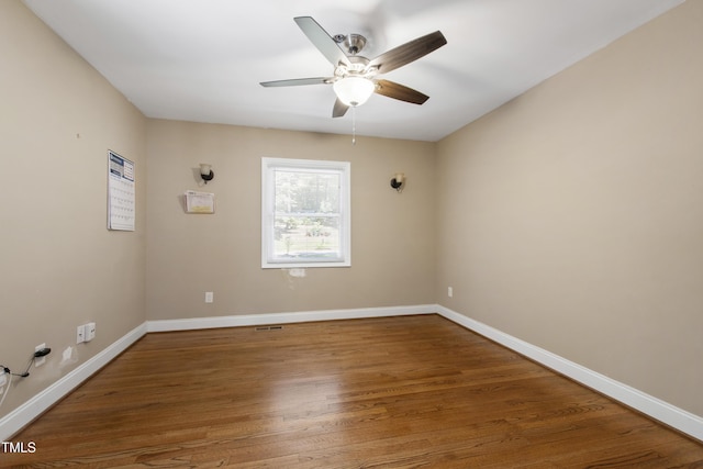 1005 Temple St, Raleigh, NC 27609 - unfurnished room with a ceiling fan, wood finished floors, and baseboards