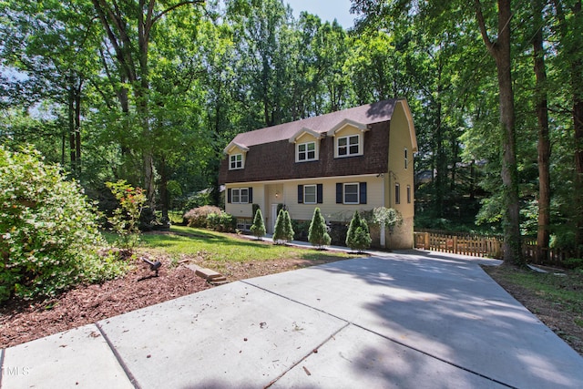 1005 Temple St, Raleigh, NC 27609 - dutch colonial with driveway, a gambrel roof, and roof with shingles
