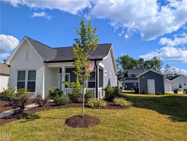 3904 Lundin Dr, Greensboro, NC 27407 - view of front of house featuring a front lawn and a shingled roof
