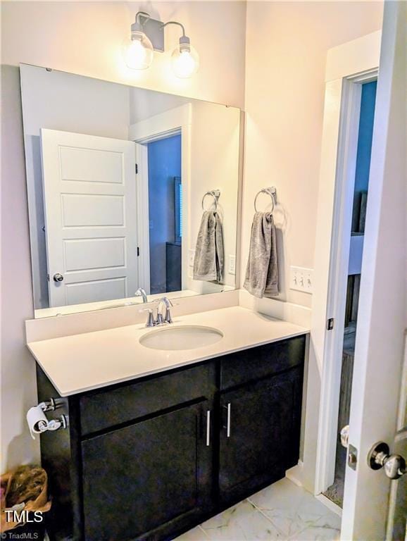 3904 Lundin Dr, Greensboro, NC 27407 - bathroom with marble look tiles and vanity