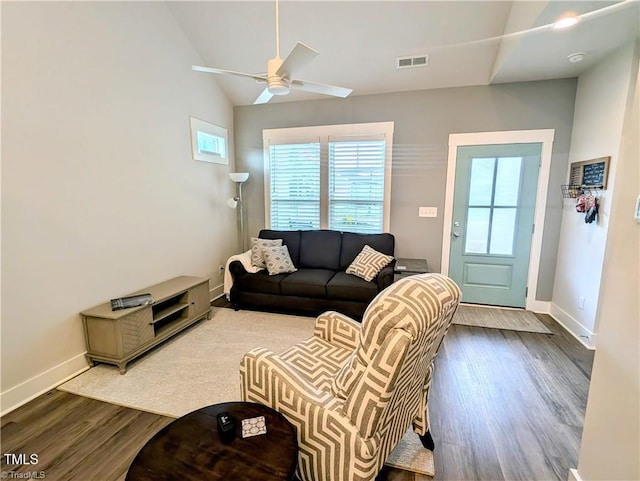 3904 Lundin Dr, Greensboro, NC 27407 - living room with wood finished floors, baseboards, ceiling fan, and vaulted ceiling