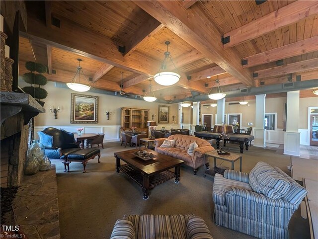 3904 Lundin Dr, Greensboro, NC 27407 - living room with wood ceiling, carpet floors, wainscoting, beam ceiling, and a fireplace with raised hearth