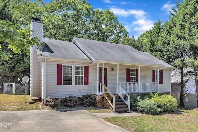 single story home featuring covered porch, a chimney, fence, crawl space, and roof with shingles