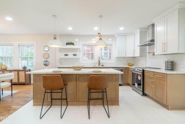 2515 W Club Blvd, Durham, NC 27705 - kitchen featuring stainless steel appliances, wall chimney exhaust hood, open shelves, a sink, and a kitchen island