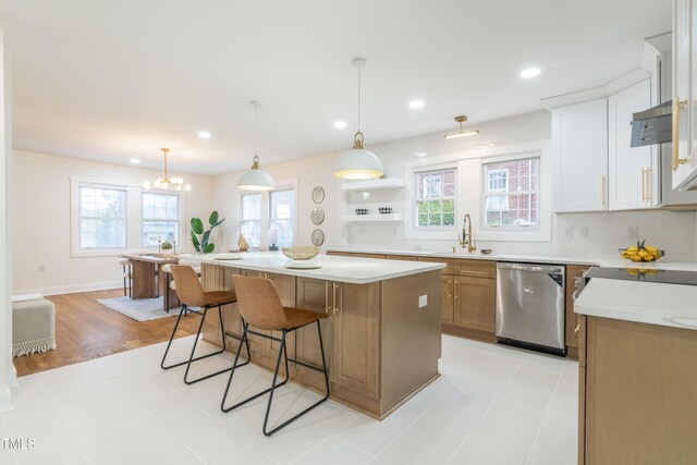 2515 W Club Blvd, Durham, NC 27705 - kitchen with stainless steel dishwasher, a sink, light countertops, a kitchen island, and recessed lighting