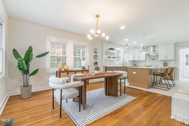 2515 W Club Blvd, Durham, NC 27705 - dining room featuring light wood-type flooring, a chandelier, baseboards, and recessed lighting
