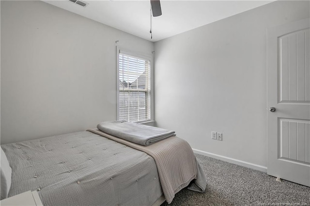 bedroom with carpet flooring, baseboards, and a ceiling fan