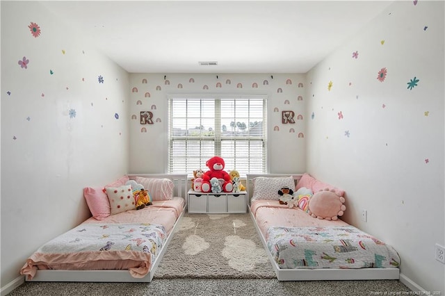 sitting room featuring carpet flooring and baseboards