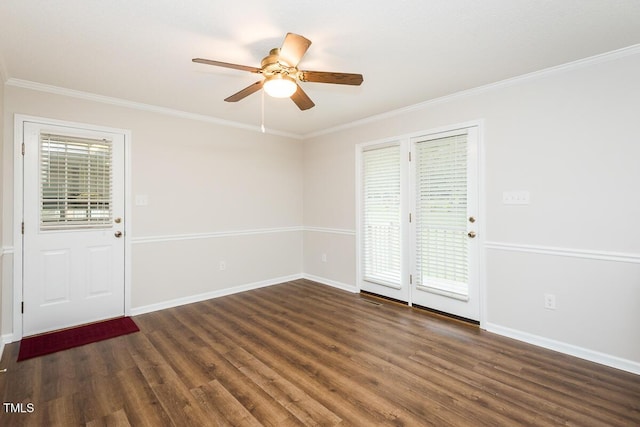 unfurnished room with dark wood-type flooring, crown molding, ceiling fan, and baseboards