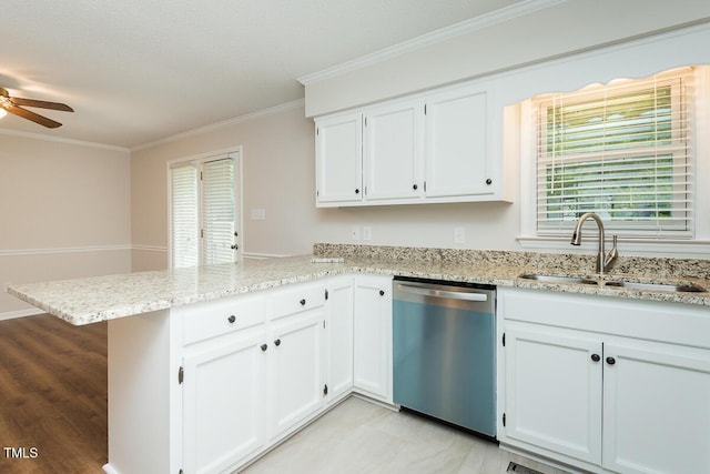 kitchen with dishwasher, a sink, a peninsula, crown molding, and white cabinetry
