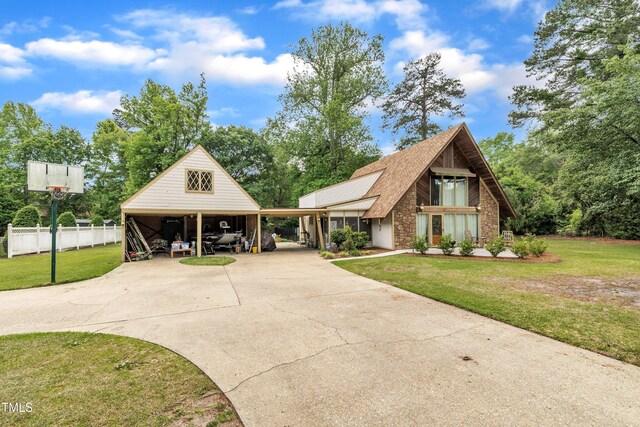 view of front of property with concrete driveway, a carport, and stone siding