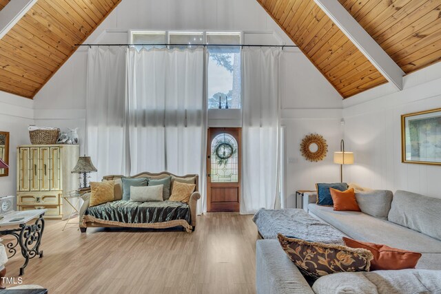 bedroom featuring high vaulted ceiling, wood ceiling, wood finished floors, and beam ceiling