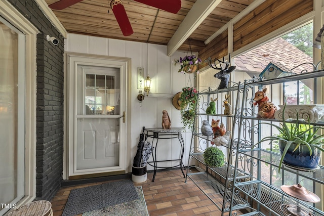 property entrance with brick siding
