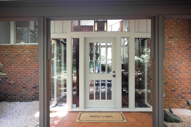 property entrance with brick siding