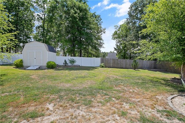 view of yard with a storage shed and an outdoor structure