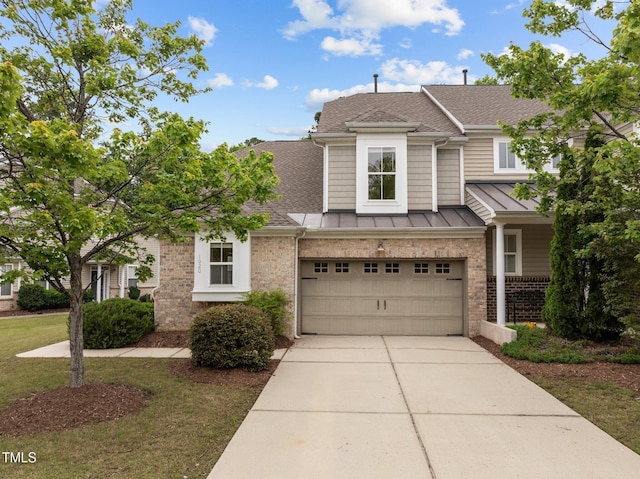 1020 Kingston Grove Dr, Cary, NC 27519 - townhome / multi-family property featuring a shingled roof, concrete driveway, a standing seam roof, and an attached garage