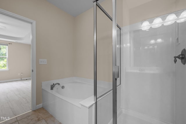 1020 Kingston Grove Dr, Cary, NC 27519 - full bath with a shower stall, a bath, baseboards, and tile patterned floors