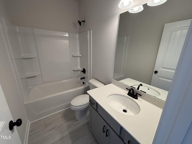 full bath with toilet, vanity, and  shower combination