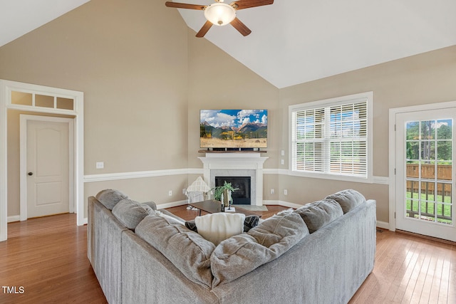 182 Brendamoore Ct, Fuquay Varina, NC 27526 - living room with high vaulted ceiling, ceiling fan, wood finished floors, a fireplace, and baseboards