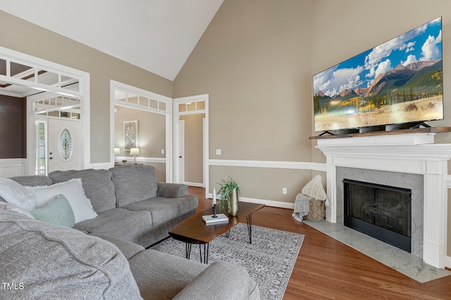 182 Brendamoore Ct, Fuquay Varina, NC 27526 - living area featuring high vaulted ceiling, wood finished floors, and a high end fireplace