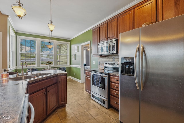 182 Brendamoore Ct, Fuquay Varina, NC 27526 - kitchen featuring stainless steel appliances, crown molding, a sink, light tile patterned floors, and hanging light fixtures