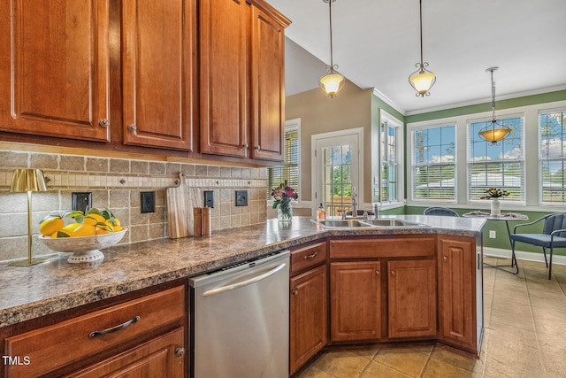 182 Brendamoore Ct, Fuquay Varina, NC 27526 - kitchen featuring dishwasher, a sink, brown cabinetry, tasteful backsplash, and a peninsula