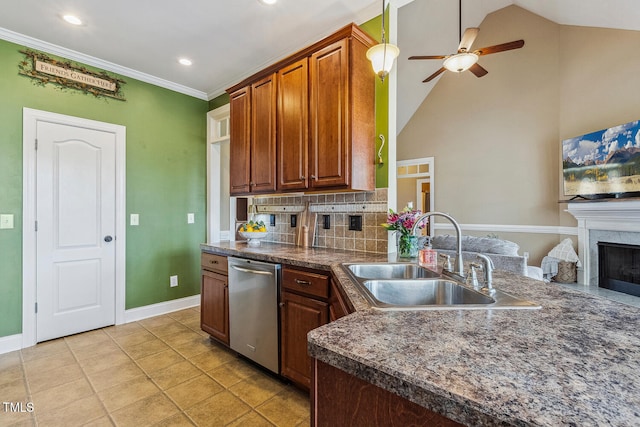 182 Brendamoore Ct, Fuquay Varina, NC 27526 - kitchen with stainless steel dishwasher, a sink, a ceiling fan, tasteful backsplash, and dark countertops