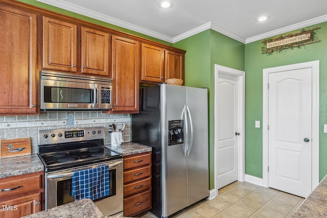 182 Brendamoore Ct, Fuquay Varina, NC 27526 - kitchen featuring appliances with stainless steel finishes, brown cabinetry, backsplash, crown molding, and light tile patterned floors