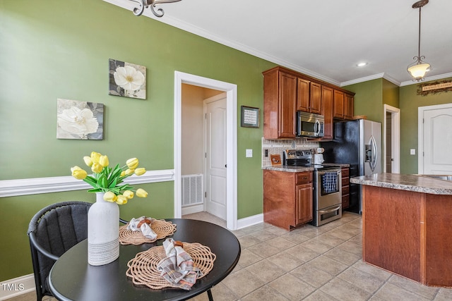 182 Brendamoore Ct, Fuquay Varina, NC 27526 - kitchen with stainless steel appliances, backsplash, pendant lighting, crown molding, and brown cabinetry