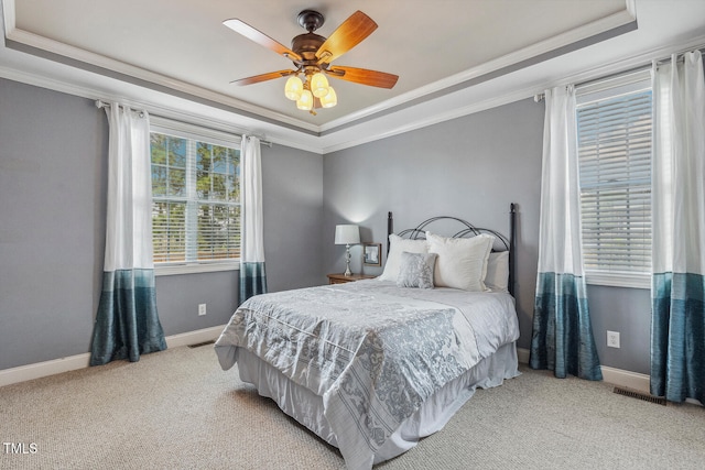 182 Brendamoore Ct, Fuquay Varina, NC 27526 - carpeted bedroom with a raised ceiling, crown molding, baseboards, and a ceiling fan