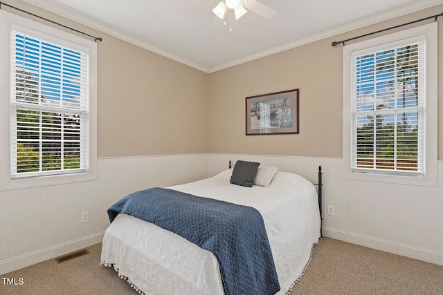 182 Brendamoore Ct, Fuquay Varina, NC 27526 - bedroom with carpet, baseboards, a wainscoted wall, crown molding, and a ceiling fan