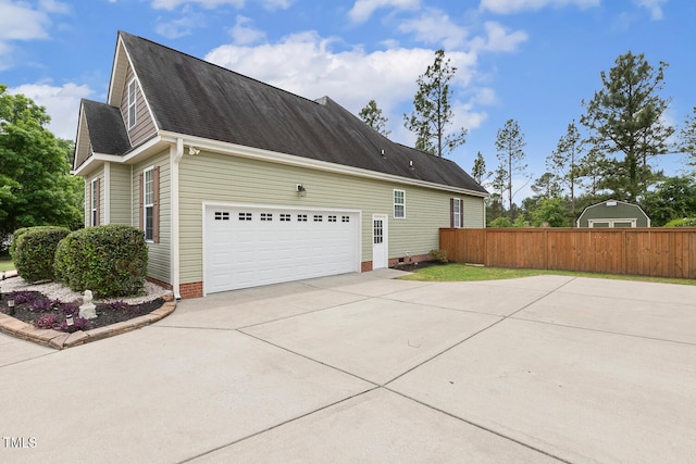 182 Brendamoore Ct, Fuquay Varina, NC 27526 - view of side of home with concrete driveway, roof with shingles, and an attached garage